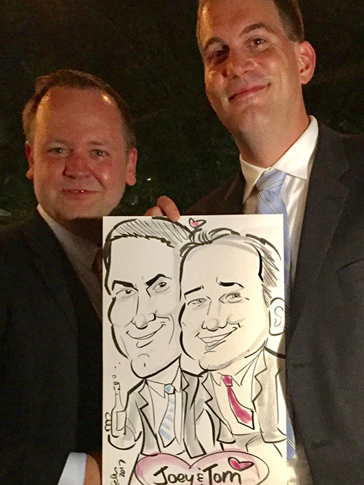 Couple pose with caricature from a wedding in DC