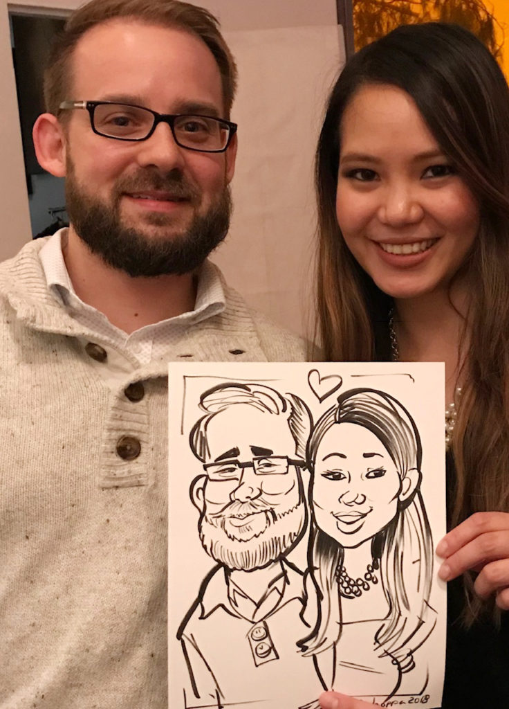Couple caricatures at holiday party