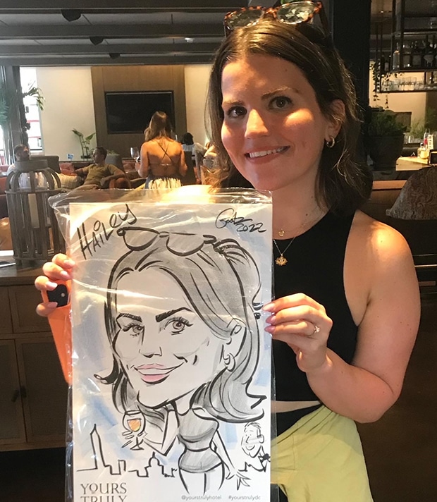 Young lady with her caricature drawn by Gootz